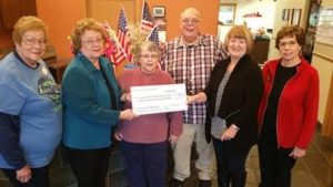 Donna Carollo and Barb Hamel (rt) present our $1,036.38   donation  to the Upper Kittitas County  Senior Center              Board for the Upper County Christmas Giving Fund 